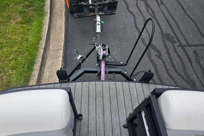Slide: The Image of Top view of a 2022 Lowe SS 230 CL boat trailer hitch on a paved road. - 25