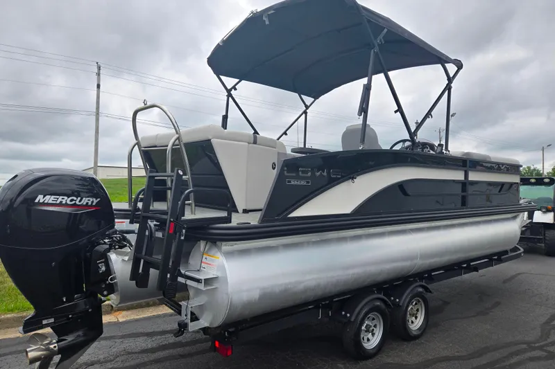 Slide: The Image of 2022 Lowe SS 230 CL pontoon boat with Mercury outboard motor on trailer. - 4