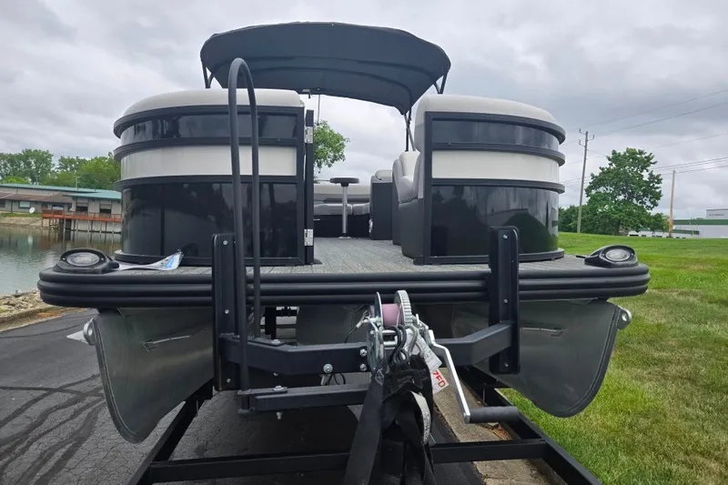 Slide: The Image of 2022 Lowe SS 230 CL pontoon boat on trailer, near water, overcast sky. - 7