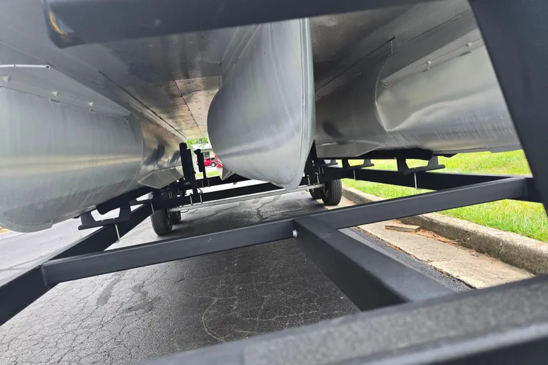 Slide: The Image of Underneath view of a 2022 Lowe SS 230 CL pontoon boat on a trailer. - 8