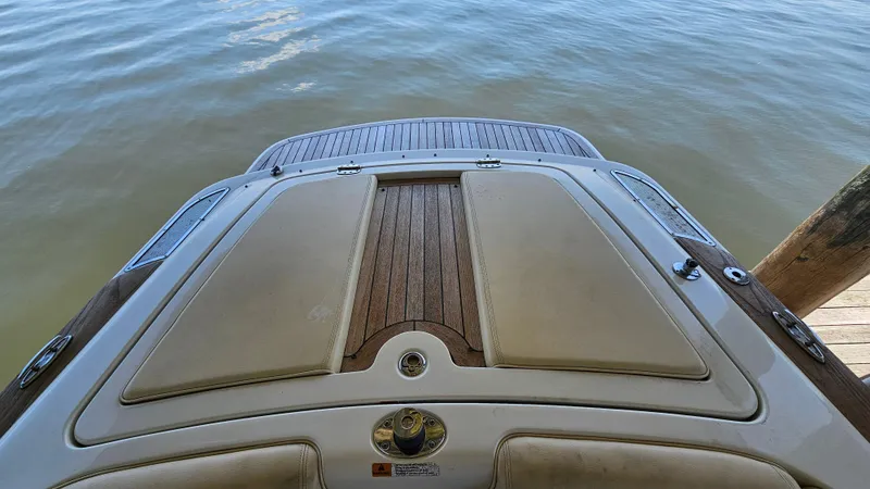 Slide: The Image of 2013 Chris-Craft Launch 22 boat stern with teak swim platform on calm water. - 17