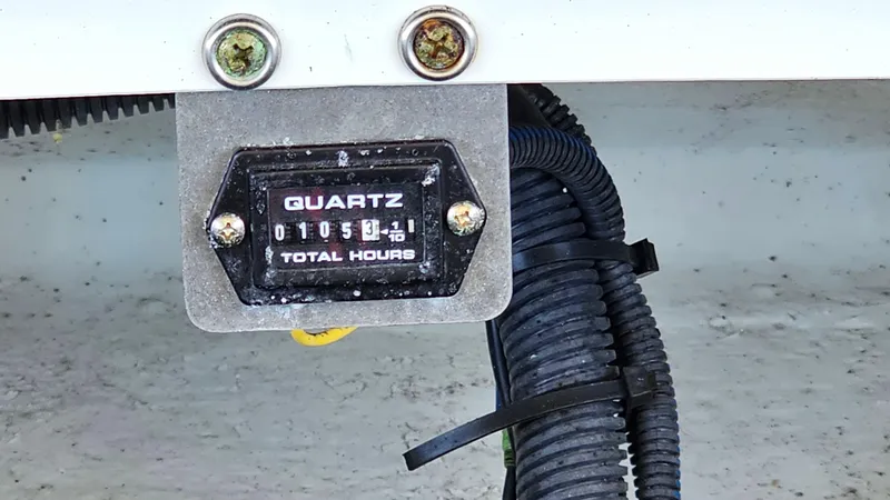 Slide: The Image of Hour meter showing 105.1 total hours on a 2013 Chris-Craft Launch 22 boat. - 20