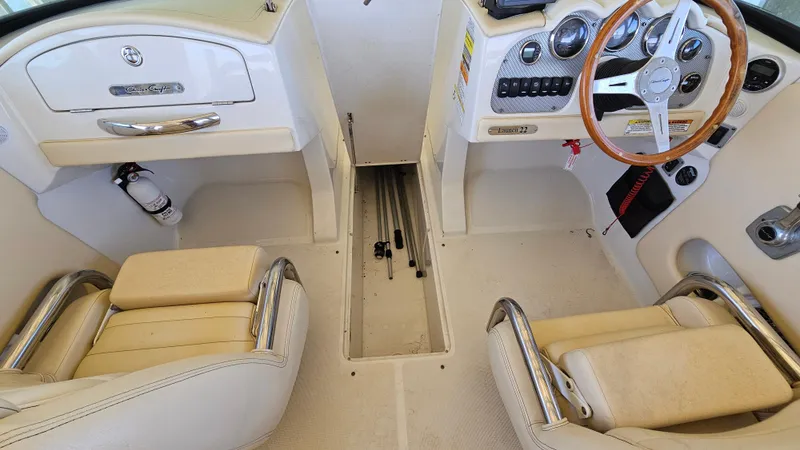 Slide: The Image of 2013 Chris-Craft Launch 22 boat interior with steering wheel and seating. - 6