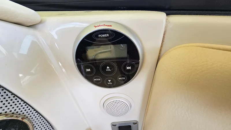 Slide: The Image of Control panel of a 2013 Chris-Craft Launch 22 boat with audio system. - 8