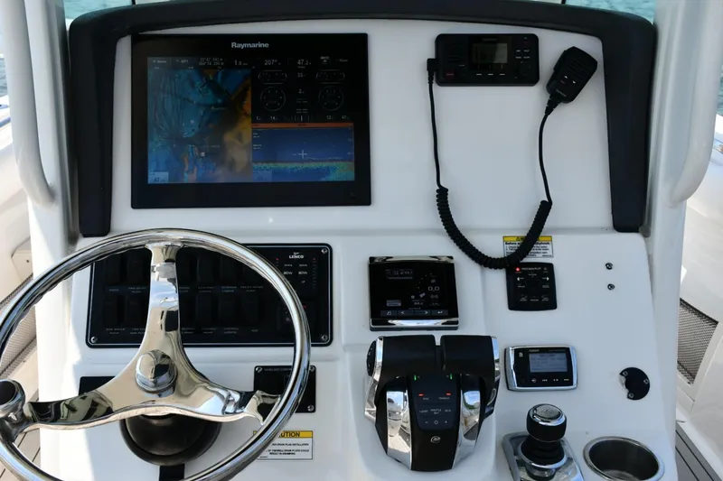 Slide: The Image of Raymarine navigation display on 2016 Boston Whaler 280 Outrage, showing map and engine data. - 11