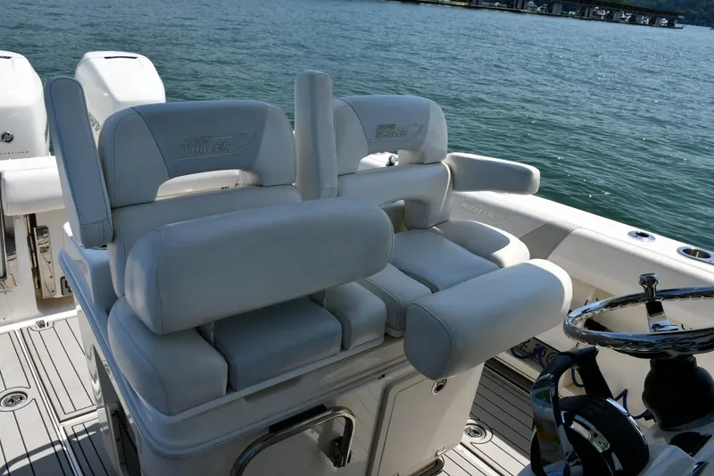 Slide: The Image of Boston Whaler 280 Outrage 2016 on calm lake with scenic forested shoreline. - 17