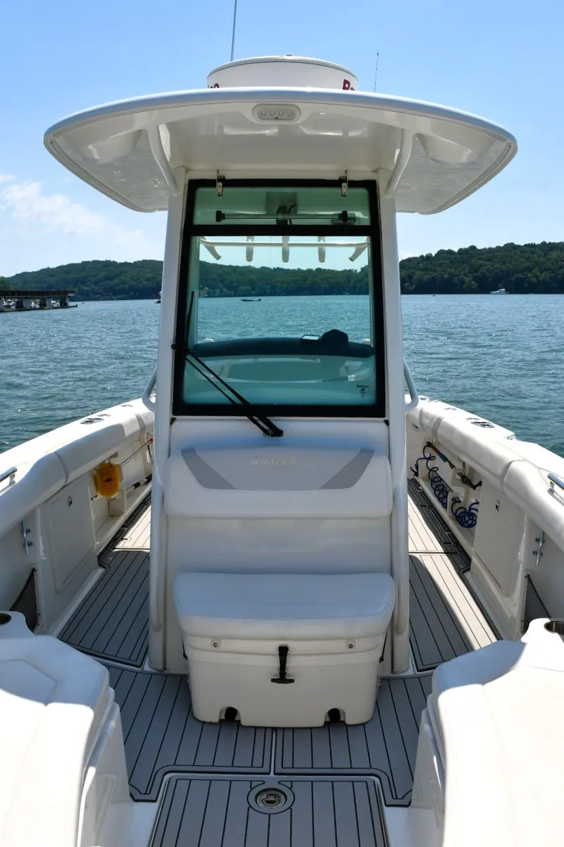 Slide: The Image of Boston Whaler 280 Outrage 2016 boat interior with sink and storage drawers. - 19