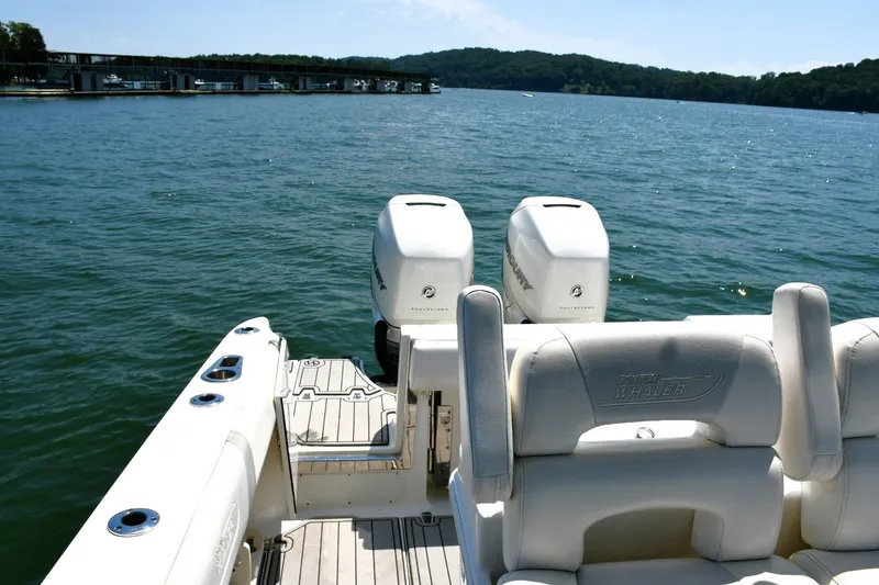 Slide: The Image of 2016 Boston Whaler 280 Outrage boat with dual engines and cushioned seating. - 24