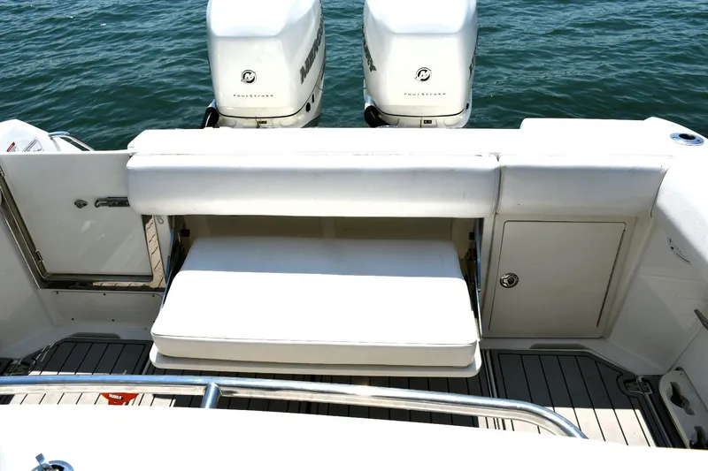 Slide: The Image of 2016 Boston Whaler 280 Outrage boat with twin Mercury engines on the water. - 25