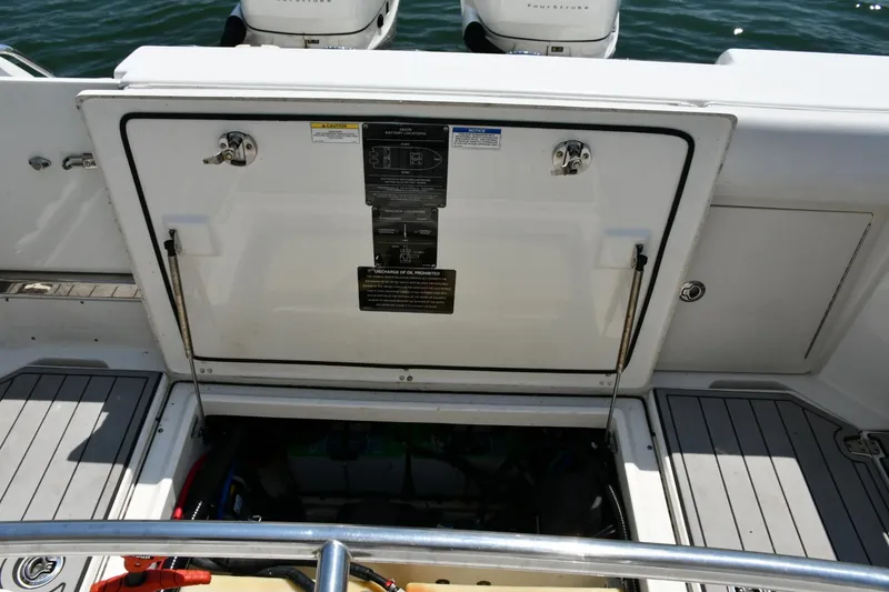 Slide: The Image of 2016 Boston Whaler 280 Outrage anchor compartment with chain and rope. - 28