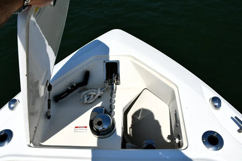 Slide: The Image of Storage compartment on a 2016 Boston Whaler 280 Outrage boat, featuring organized tackle boxes. - 29