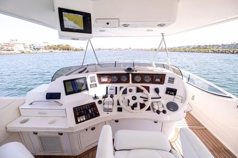 Slide: The Image of Helm of 2002 Sea Ray 560 Sedan Bridge yacht with navigation equipment and ocean view. - 26