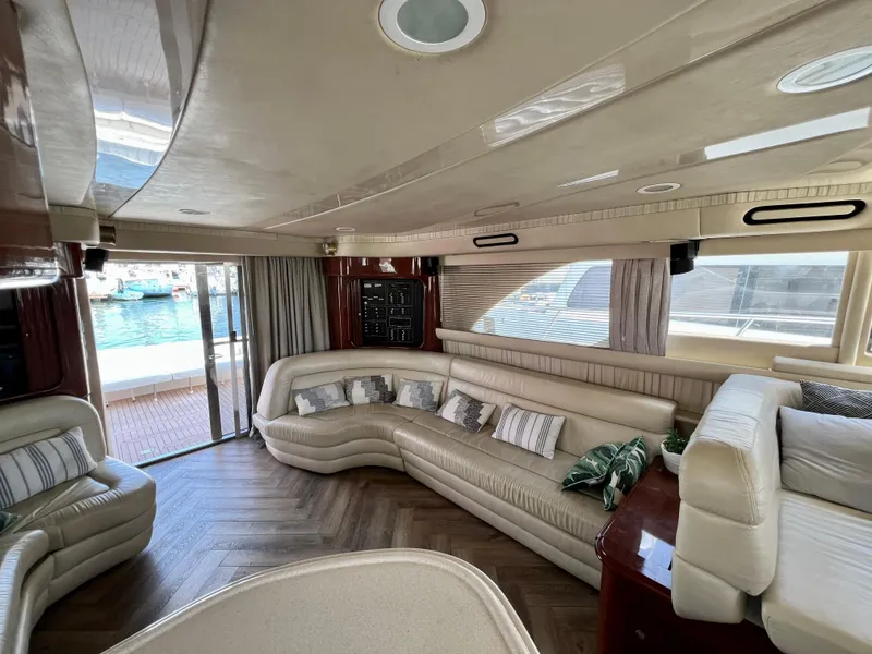 Slide: The Image of Luxurious interior of a 2002 Sea Ray 560 Sedan Bridge yacht with elegant seating. - 32