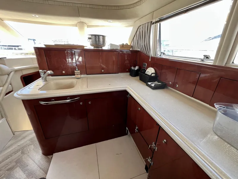 Slide: The Image of Luxurious kitchen interior of 2002 Sea Ray 560 Sedan Bridge yacht. - 38