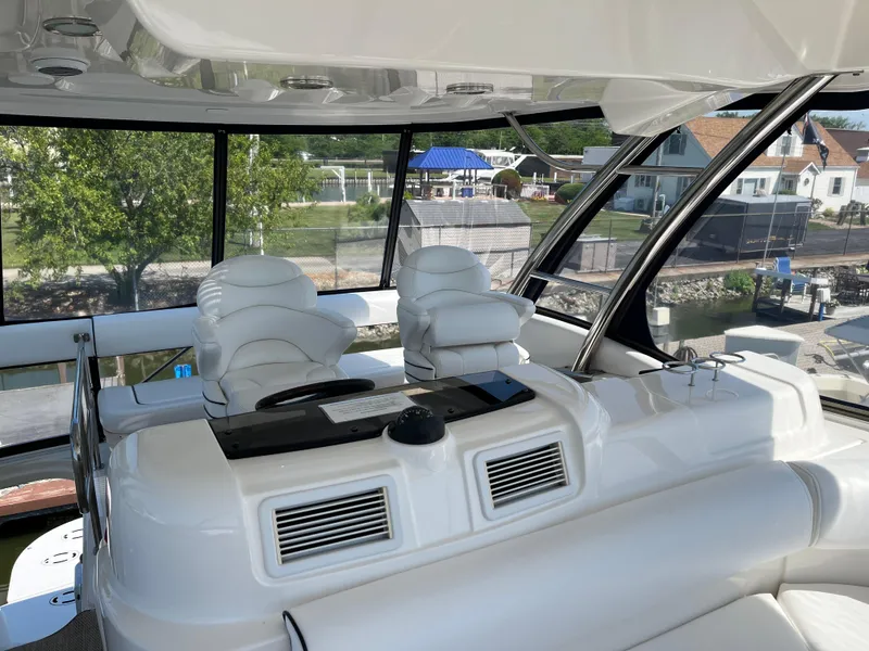 Slide: The Image of Luxurious interior of 2008 Sea Ray 58 Sedan yacht with white leather seating. - 12