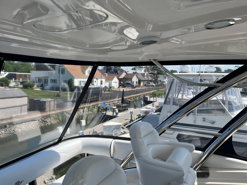 Slide: The Image of Interior view of 2008 Sea Ray 58 Sedan yacht with marina backdrop. - 13
