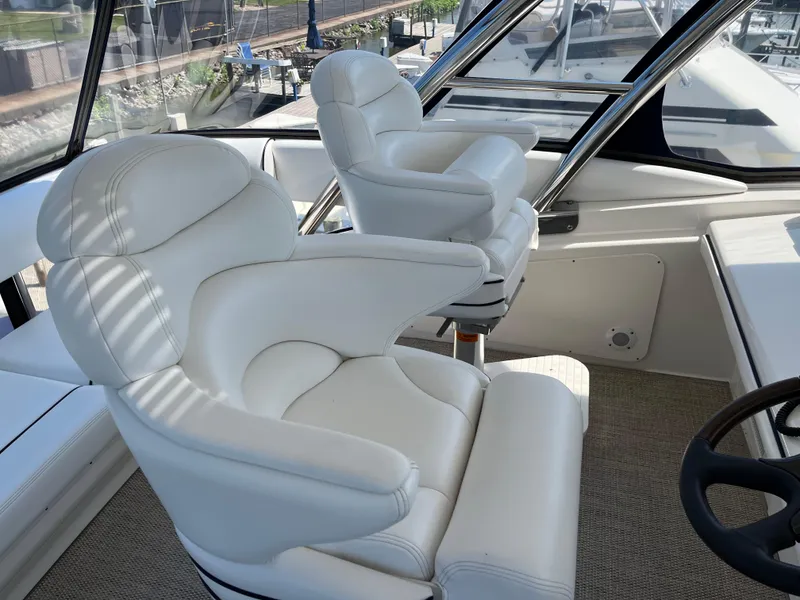 Slide: The Image of Luxurious white captain chairs on 2008 Sea Ray 58 Sedan yacht. - 14