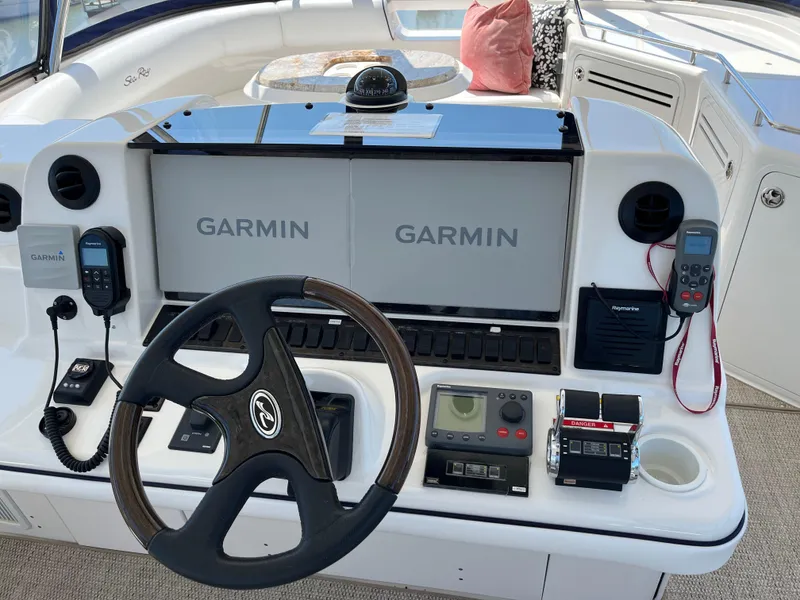 Slide: The Image of Helm of 2008 Sea Ray 58 Sedan with Garmin navigation system and steering wheel. - 20