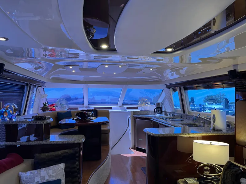 Slide: The Image of Luxurious interior of a 2008 Sea Ray 58 Sedan yacht with modern furnishings and ambient lighting. - 28