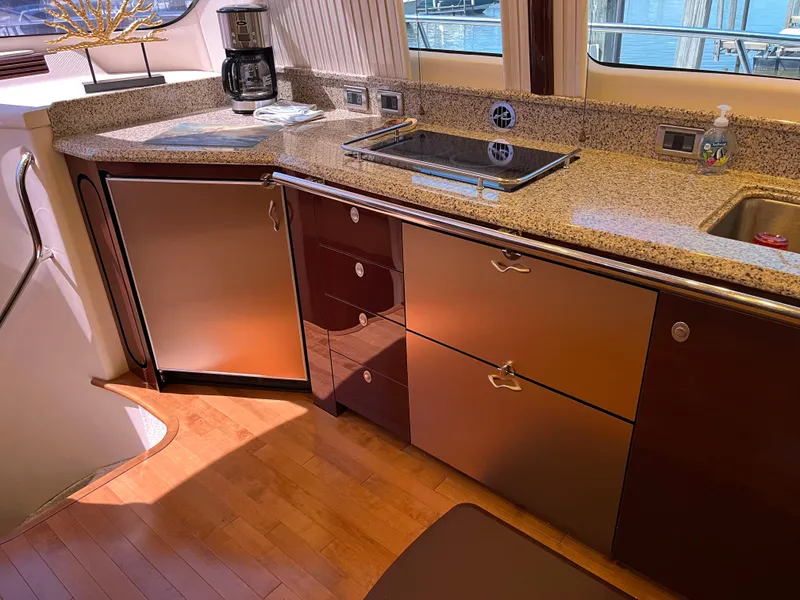Slide: The Image of Luxurious kitchen interior of 2008 Sea Ray 58 Sedan yacht with granite countertops. - 32