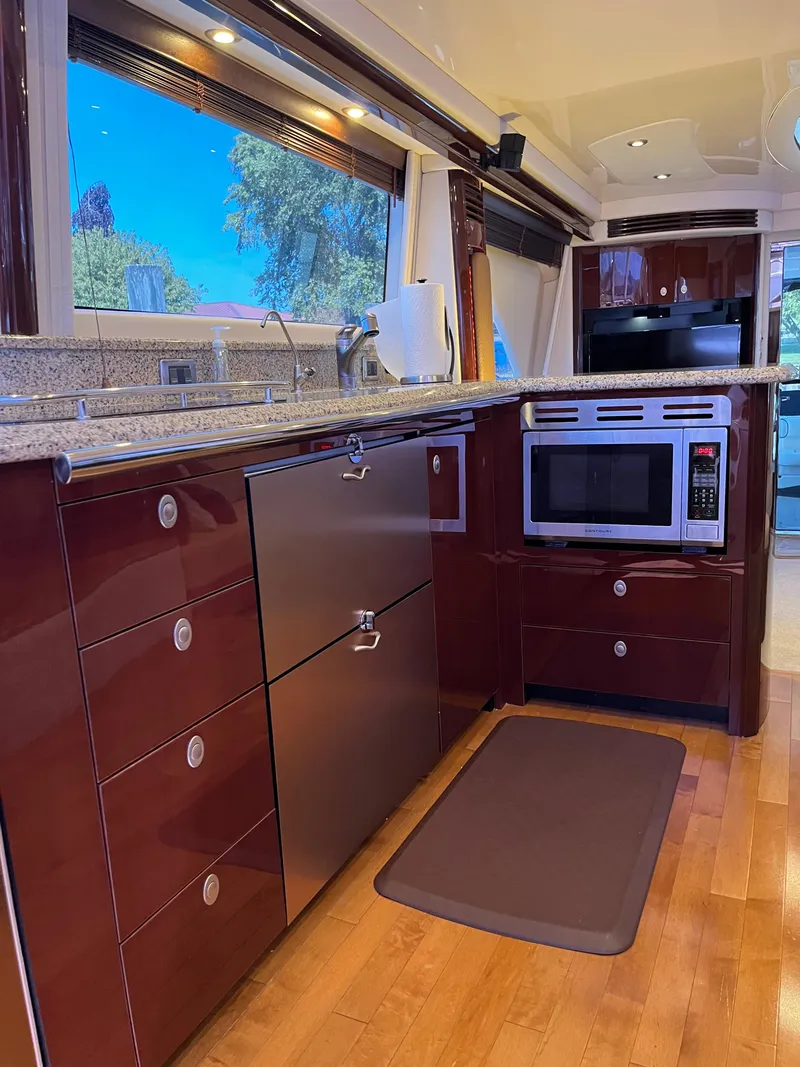 Slide: The Image of Luxurious kitchen interior of 2008 Sea Ray 58 Sedan yacht with modern appliances. - 33