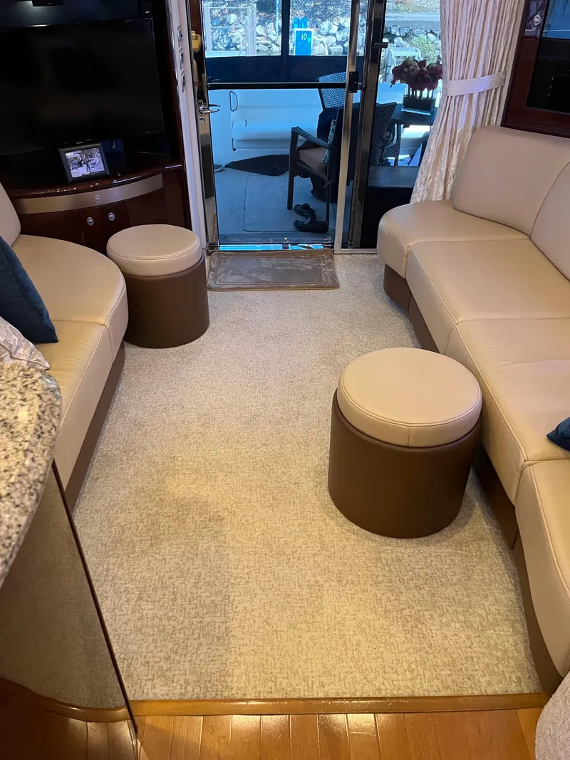 Slide: The Image of Interior of a 2008 Sea Ray 58 Sedan yacht with beige seating and modern decor. - 36