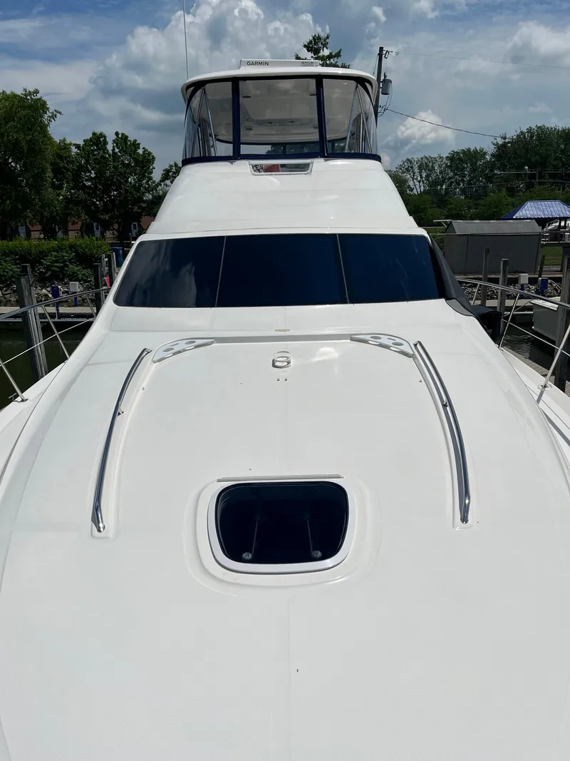 Slide: The Image of 2008 Sea Ray 58 Sedan yacht with sleek white deck and tinted windows. - 4