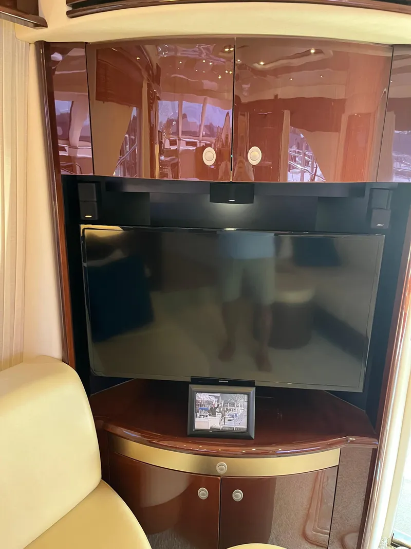 Slide: The Image of Interior of 2008 Sea Ray 58 Sedan with TV and wooden cabinetry. - 41