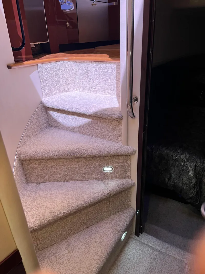 Slide: The Image of Carpeted stairs with lighting inside a 2008 Sea Ray 58 Sedan yacht. - 43