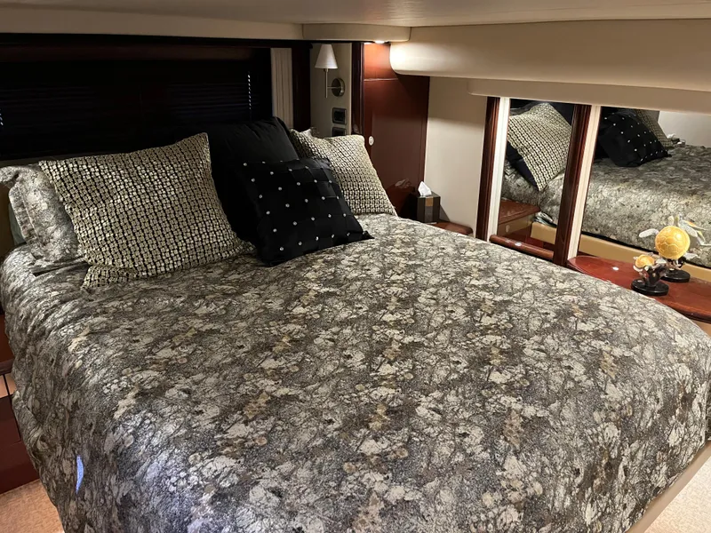 Slide: The Image of Luxurious bedroom interior of 2008 Sea Ray 58 Sedan yacht with elegant bedding and decor. - 45