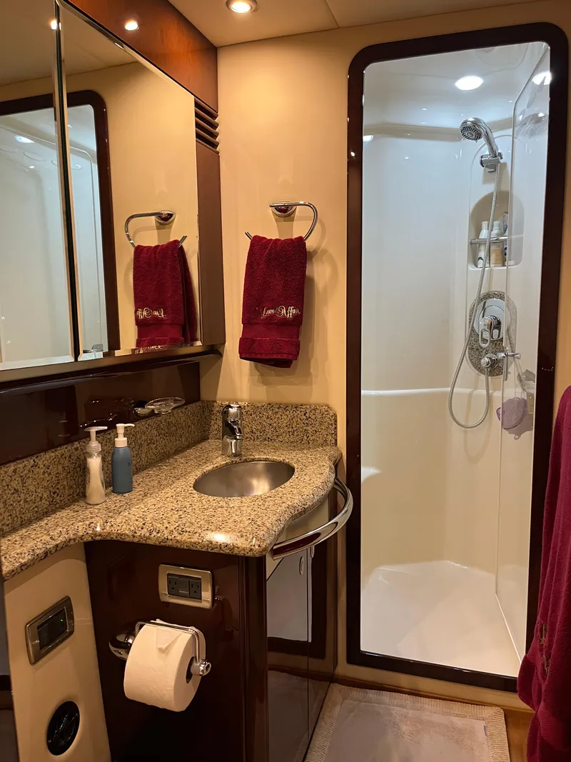 Slide: The Image of Luxurious bathroom in 2008 Sea Ray 58 Sedan yacht with granite countertop and shower. - 48