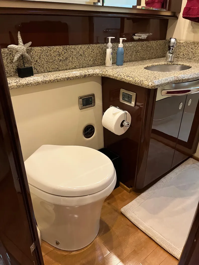 Slide: The Image of Luxurious bathroom in 2008 Sea Ray 58 Sedan yacht with granite countertop and modern fixtures. - 49