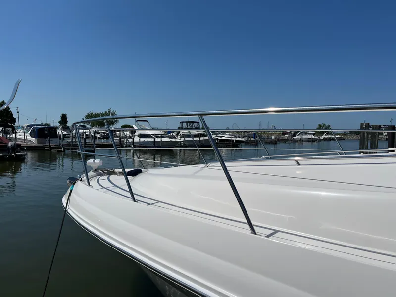 Slide: The Image of 2008 Sea Ray 58 Sedan yacht docked at a marina under clear blue skies. - 5