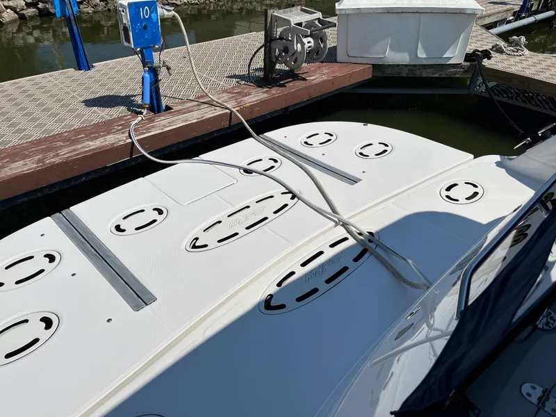 Slide: The Image of 2008 Sea Ray 58 Sedan yacht docked, showing deck details and mooring lines. - 9