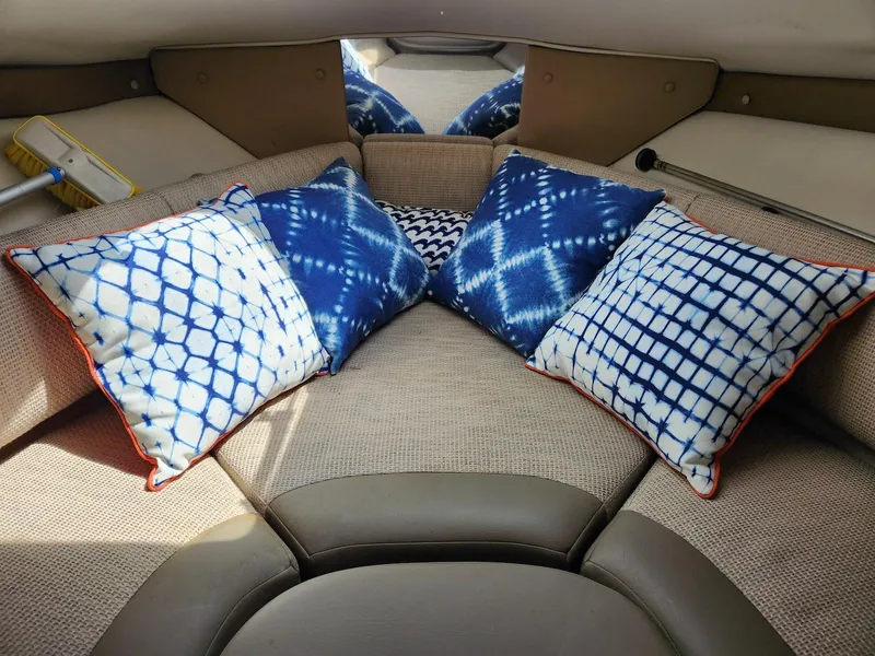 Slide: The Image of Interior of 2004 Chaparral Signature 240 with blue patterned pillows. - 10