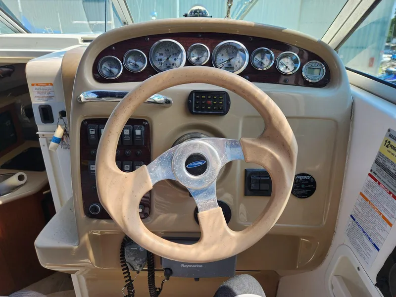 Slide: The Image of Steering wheel and dashboard of a 2004 Chaparral Signature 240 boat. - 7