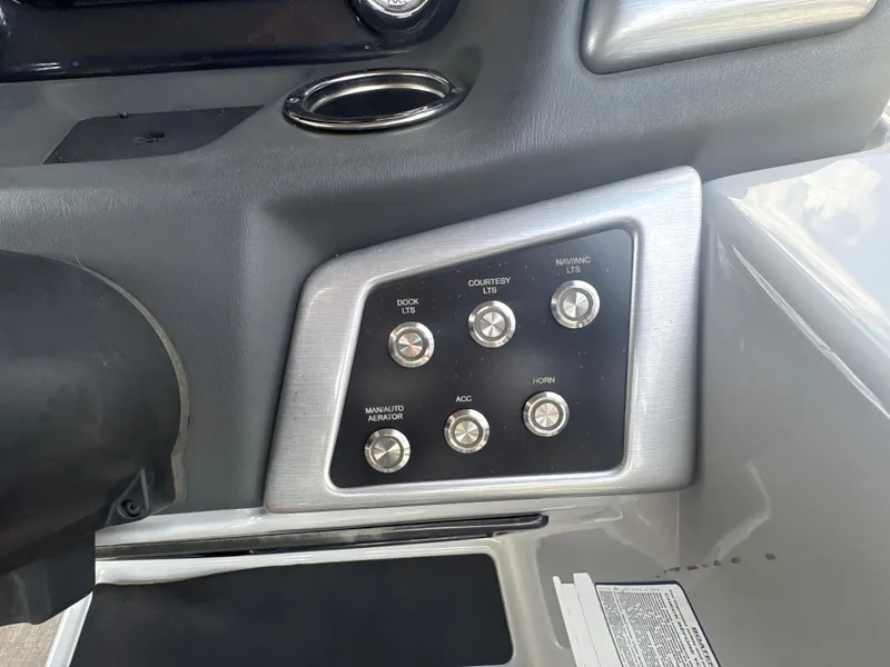 Slide: The Image of Control panel of a 2021 Ranger Reata 220F boat with labeled switches. - 15