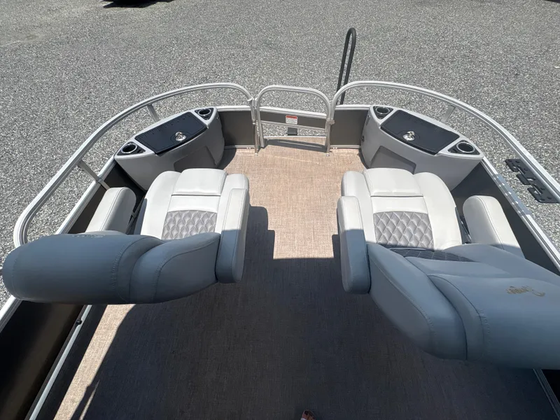 Slide: The Image of 2021 Ranger Reata 220F boat interior with plush seating and cup holders. - 17