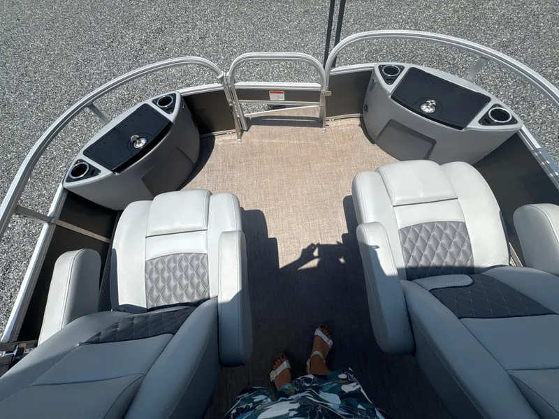 Slide: The Image of 2021 Ranger Reata 220F boat interior with plush seating and modern design. - 19