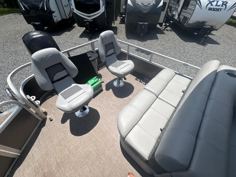 Slide: The Image of 2021 Ranger Reata 220F boat interior with gray seating and modern design. - 7