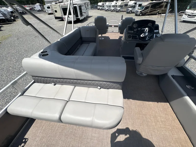Slide: The Image of Interior of 2021 Ranger Reata 220F boat with gray seating and steering console. - 8