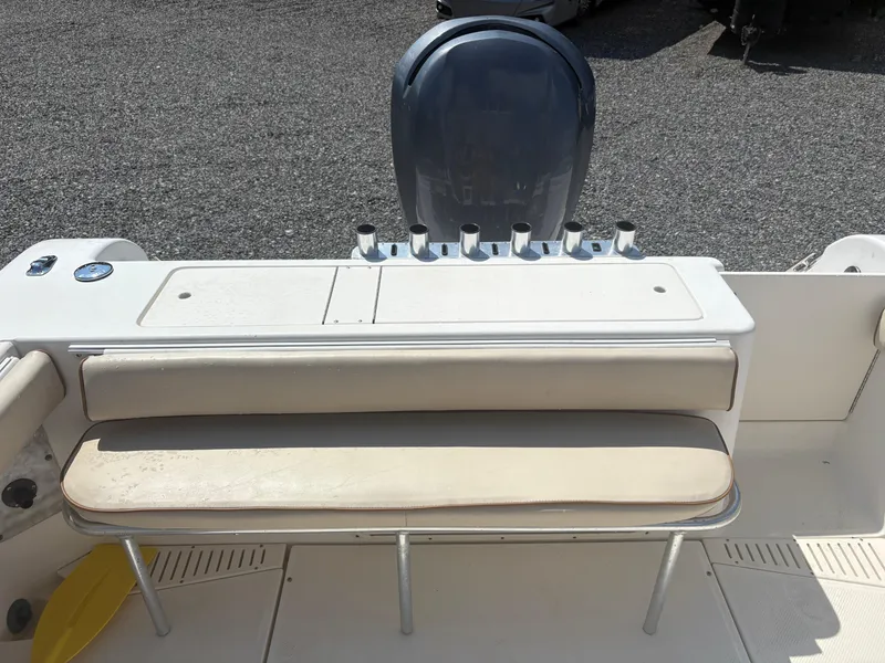 Slide: The Image of Key West 2300 Bluewater 2000 boat interior with seating and rod holders. - 12