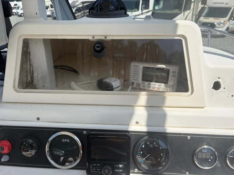 Slide: The Image of Dashboard of a 2000 Key West 2300 Bluewater boat with GPS and gauges. - 14