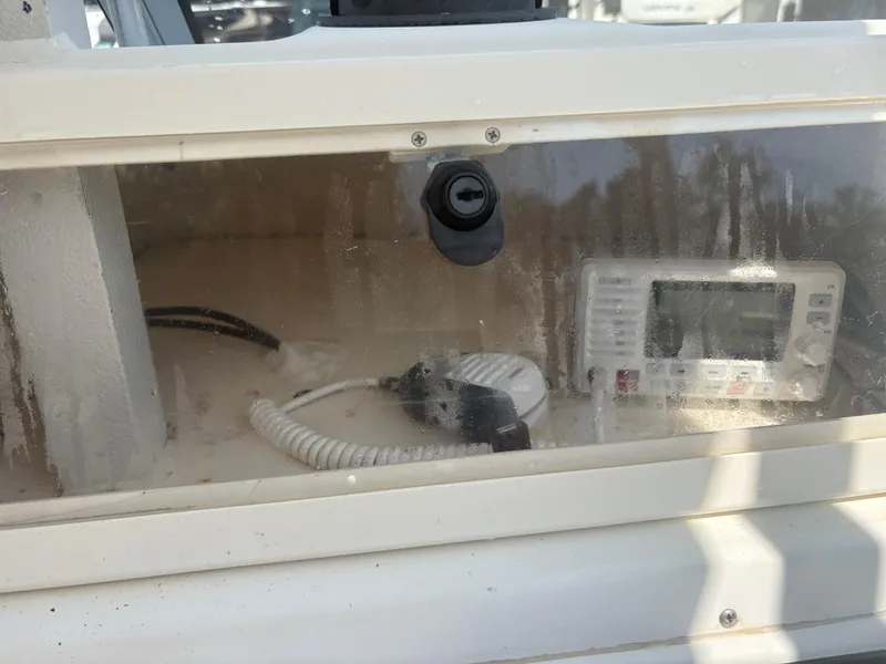 Slide: The Image of Boat dashboard with radio equipment on a 2000 Key West 2300 Bluewater. - 17