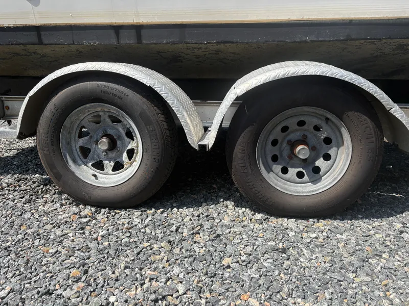 Slide: The Image of Trailer wheels on gravel, Key West 2300 Bluewater, 2000 model. - 7