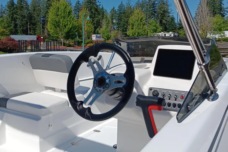 Slide: The Image of Interior of 2025 Tahoe T16 boat with steering wheel and control panel. - 4