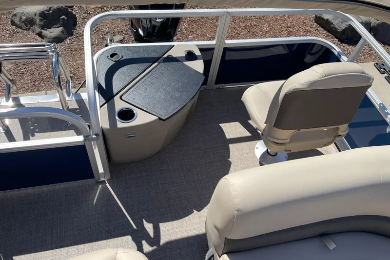 Slide: The Image of 2025 Sun Tracker Bass Buggy 18 DLX interior with seating and console. - 6