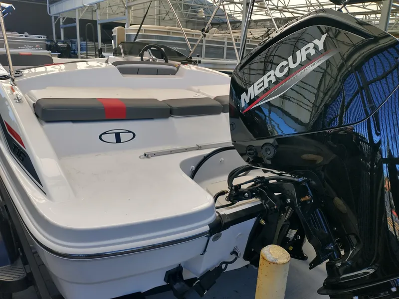 Slide: The Image of 2025 Tahoe T16 boat with Mercury engine, docked in a marina. - 4