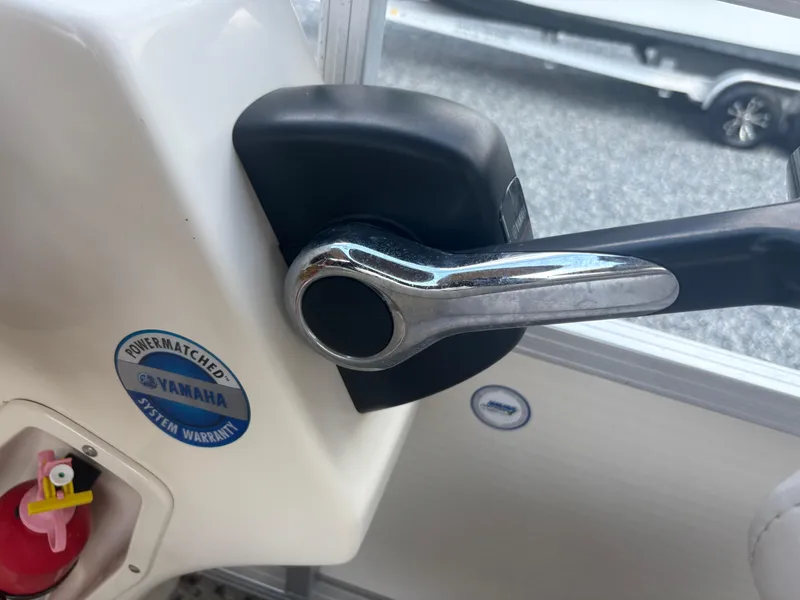 Slide: The Image of Throttle control of 2009 Avalon Paradise 24' boat with Yamaha system warranty sticker. - 13