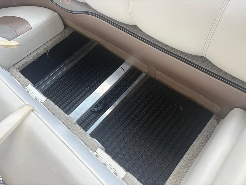 Slide: The Image of 2009 Avalon Paradise 24' boat interior storage compartment with open seat view. - 15